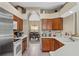 Well-equipped kitchen with stainless steel appliances and white countertops, ideal for culinary enthusiasts at 901 Dorset Pl, Davenport, FL 33896