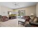 Spacious living room leading to a screened lanai and pool, great for seamless indoor-outdoor enjoyment at 901 Dorset Pl, Davenport, FL 33896