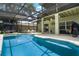 A screened-in pool, accompanied with patio furniture, provides the perfect retreat for entertainment and relaxation at 901 Dorset Pl, Davenport, FL 33896