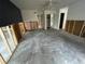 Bedroom showing wall studs, dark accent wall, and an open doorway at 924 Mill Road Ln, Port Orange, FL 32127