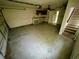 A large garage featuring stairs, built in storage, and a service door for extra convenience at 924 Mill Road Ln, Port Orange, FL 32127