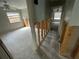 Hallway with open wall showing studs and a glimpse into other rooms at 924 Mill Road Ln, Port Orange, FL 32127