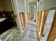 Hallway featuring opened walls with wiring and tile flooring at 924 Mill Road Ln, Port Orange, FL 32127