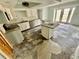 A partially renovated kitchen featuring granite counters, white cabinets, and an island at 924 Mill Road Ln, Port Orange, FL 32127