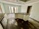 Kitchen with center island, stainless steel appliances, and door leading to backyard at 924 Mill Road Ln, Port Orange, FL 32127
