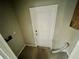 A functional utility area with a simple white door and utility hookups ready for appliances at 924 Mill Road Ln, Port Orange, FL 32127