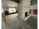 Living room with stone fireplace and large window providing natural light at 924 Mill Road Ln, Port Orange, FL 32127