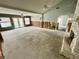 The living room featuring ceiling fans, sliding glass doors, and lots of open space at 924 Mill Road Ln, Port Orange, FL 32127