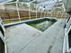 Backyard pool with a screened enclosure for private relaxation and enjoyment at 924 Mill Road Ln, Port Orange, FL 32127