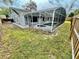 Backyard pool and spa with screen enclosure, ideal for outdoor relaxation and entertainment at 924 Mill Road Ln, Port Orange, FL 32127