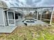 Screened-in backyard pool featuring a spa, providing a private and relaxing outdoor space at 924 Mill Road Ln, Port Orange, FL 32127