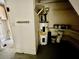 Water heater and some supplies are stored in this space under the staircase at 924 Mill Road Ln, Port Orange, FL 32127