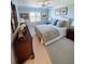 Serene bedroom featuring a comfortable bed, soft blue walls, and natural light from the window at 100 S Interlachen Ave # 502D, Winter Park, FL 32789