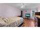 A relaxing bedroom offering a cozy desk area and a dresser, finished with warm, wood-look floors at 109 Sweetwater Oaks Ln, Daytona Beach, FL 32114