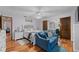 A bedroom featuring a seating area, mirror closet, and wood-look flooring at 109 Sweetwater Oaks Ln, Daytona Beach, FL 32114