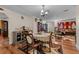 Dining room with a round table, chairs, and an open view to the living room and TV at 109 Sweetwater Oaks Ln, Daytona Beach, FL 32114