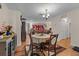 Open dining area with a round table, chairs, and a view into the living room at 109 Sweetwater Oaks Ln, Daytona Beach, FL 32114