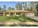 Close view of this well-maintained single-Gathering home showing the landscaped yard at 109 Sweetwater Oaks Ln, Daytona Beach, FL 32114
