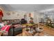 Cozy living room featuring plush furniture and warm, inviting decor, with access to dining and kitchen at 109 Sweetwater Oaks Ln, Daytona Beach, FL 32114