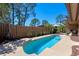 Sparkling swimming pool with surrounding patio and lush landscaping, creating a private backyard oasis at 133 Heron Bay Cir, Lake Mary, FL 32746