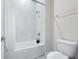 Bright bathroom features a tiled shower-over-tub and a modern toilet at 13589 Mcmillan Dr, Orlando, FL 32827