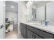 Bathroom featuring a double vanity, ample storage, and modern finishes at 13589 Mcmillan Dr, Orlando, FL 32827