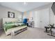 Cozy bedroom featuring carpet floors, a large bed, and entertainment at 13589 Mcmillan Dr, Orlando, FL 32827