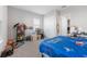 Bedroom featuring playful decor, bright natural light, and ample storage at 13589 Mcmillan Dr, Orlando, FL 32827