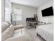 Bedroom features multiple monitors on desk, couch, and a bed frame at 13589 Mcmillan Dr, Orlando, FL 32827