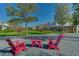 Outdoor seating area with colorful chairs and manicured lawn at 13589 Mcmillan Dr, Orlando, FL 32827