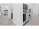 A modern laundry room with gray cabinets and a washer and dryer, conveniently located near the living area at 13589 Mcmillan Dr, Orlando, FL 32827