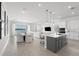 Bright living room with modern décor, and an open-concept floor plan with seamless flow to the kitchen at 13589 Mcmillan Dr, Orlando, FL 32827