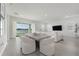 Spacious living room and dining area with stylish furniture and large windows offering a scenic lake view at 13589 Mcmillan Dr, Orlando, FL 32827