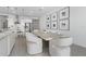 Bright open-concept space combines a dining area with an elegant table, offering seamless kitchen access at 13589 Mcmillan Dr, Orlando, FL 32827