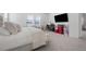 View of a well-lit main bedroom with a cozy bed, desk, and bright natural light at 13589 Mcmillan Dr, Orlando, FL 32827