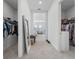 Hallway between two fully stocked walk-in closets with ample storage at 13589 Mcmillan Dr, Orlando, FL 32827