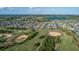Aerial view of community featuring lush golf course, serene lakes, and well-maintained landscaping at 14602 Winter Stay Dr, Winter Garden, FL 34787