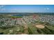 Aerial view featuring the property's proximity to a community golf course, lakes and overall community at 14602 Winter Stay Dr, Winter Garden, FL 34787