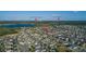 Aerial view showcasing a Primary-planned community, community lakes, and distant views of Disney's Magic Kingdom and Epcot at 14602 Winter Stay Dr, Winter Garden, FL 34787