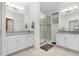 Bright bathroom featuring double sinks, granite countertops, and glass-enclosed shower with tile surround at 14602 Winter Stay Dr, Winter Garden, FL 34787