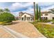 Elegant clubhouse featuring stone accents, lush landscaping, and a welcoming entrance, creating a vibrant community hub at 14602 Winter Stay Dr, Winter Garden, FL 34787
