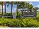 A view of the Watermark community sign surrounded by lush landscaping and palm trees at 14602 Winter Stay Dr, Winter Garden, FL 34787