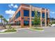 A view of the exterior of a modern mixed use building with a gastropub and taproom at 14602 Winter Stay Dr, Winter Garden, FL 34787
