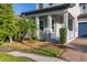 Covered front porch with seating area, offering a relaxing outdoor space at 14602 Winter Stay Dr, Winter Garden, FL 34787