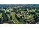 Scenic aerial view of the community golf course, featuring manicured greens, sand traps, and lush landscaping at 14602 Winter Stay Dr, Winter Garden, FL 34787