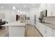 Open concept kitchen with granite countertops, stainless steel appliances, and lots of cabinet space at 14602 Winter Stay Dr, Winter Garden, FL 34787