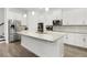 Bright, modern kitchen featuring granite countertops, stainless steel appliances, and wood flooring at 14602 Winter Stay Dr, Winter Garden, FL 34787