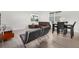 Open-concept living room featuring modern furniture, neutral walls and luxury vinyl plank flooring at 14602 Winter Stay Dr, Winter Garden, FL 34787