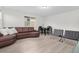 Spacious living room features an open concept design with luxury vinyl plank flooring and modern furniture at 14602 Winter Stay Dr, Winter Garden, FL 34787