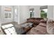 Inviting living room featuring comfortable seating, large windows and sleek hardwood floors, creating a cozy and stylish atmosphere at 14602 Winter Stay Dr, Winter Garden, FL 34787
